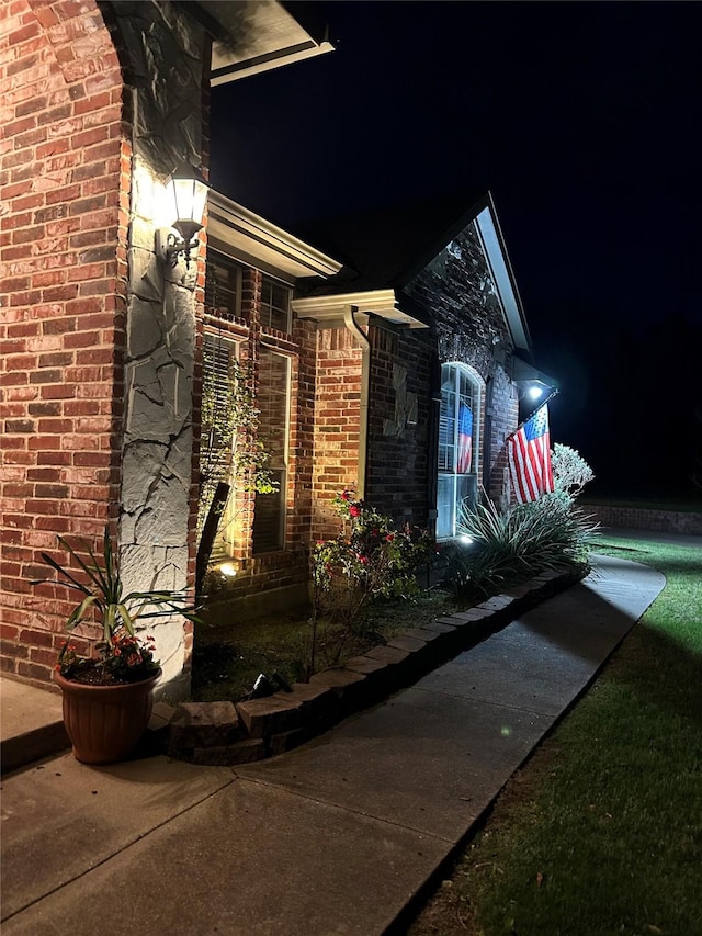 2610 Jakes Ct, Midlothian, TX 76065 - exterior entry at twilight with brick siding
