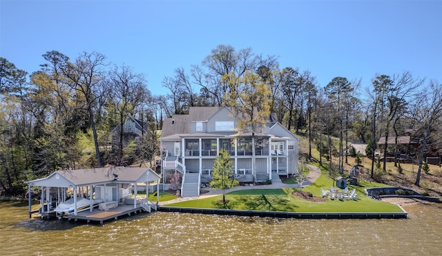 712 Camp Cypress Trl, Winnsboro, TX 75494 - rear view of property with a water view, a sunroom, stairway, boat lift, and a yard
