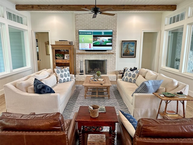 712 Camp Cypress Trl, Winnsboro, TX 75494 - living area featuring a brick fireplace, ceiling fan, wood finished floors, beam ceiling, and wooden ceiling