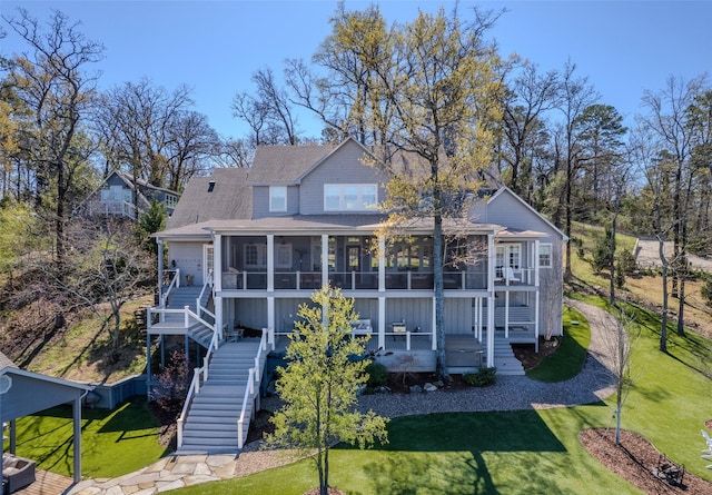 712 Camp Cypress Trl, Winnsboro, TX 75494 - back of property with a lawn, a sunroom, stairs, and roof with shingles