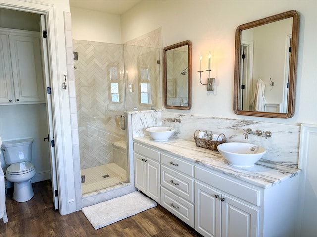 712 Camp Cypress Trl, Winnsboro, TX 75494 - full bath featuring double vanity, a sink, a stall shower, and wood finished floors