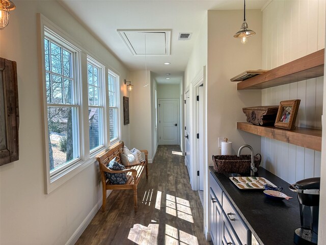 712 Camp Cypress Trl, Winnsboro, TX 75494 - corridor with attic access, visible vents, dark wood finished floors, and a sink