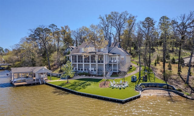 712 Camp Cypress Trl, Winnsboro, TX 75494 - rear view of property with a deck with water view, a sunroom, a yard, and stairs