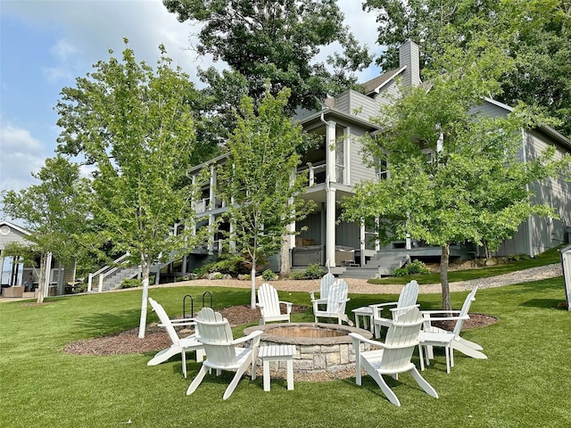 712 Camp Cypress Trl, Winnsboro, TX 75494 - view of property's community with a fire pit, stairway, and a yard