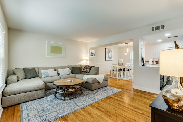 6345 Bordeaux Ave, Dallas, TX 75209 - living room with baseboards, light wood-style floors, and visible vents