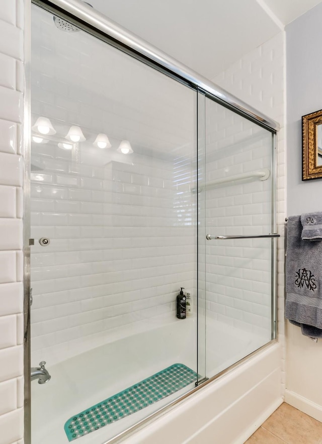 6345 Bordeaux Ave, Dallas, TX 75209 - bathroom with combined bath / shower with glass door and tile patterned flooring