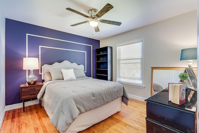 6345 Bordeaux Ave, Dallas, TX 75209 - bedroom featuring baseboards, ceiling fan, and light wood-type flooring