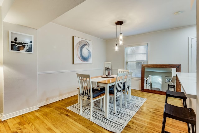 6345 Bordeaux Ave, Dallas, TX 75209 - dining space featuring baseboards and light wood-type flooring