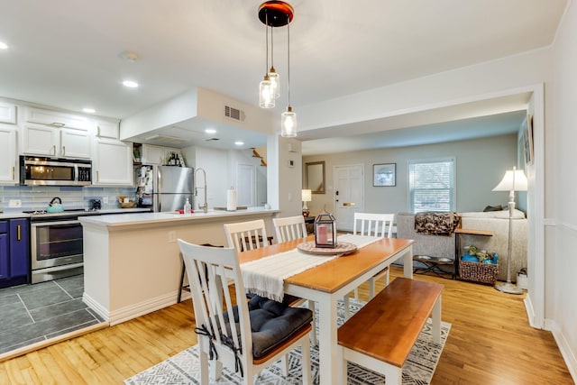 6345 Bordeaux Ave, Dallas, TX 75209 - dining space with recessed lighting, light wood finished floors, and visible vents