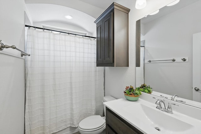 full bathroom with toilet and vanity