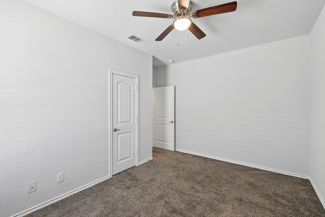 unfurnished bedroom with ceiling fan, baseboards, visible vents, and carpet floors