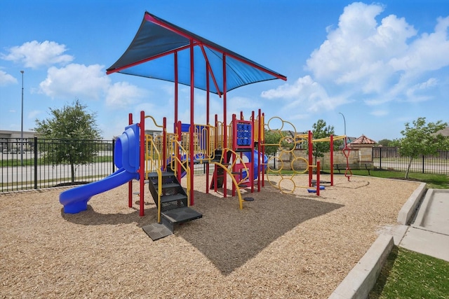 communal playground featuring fence