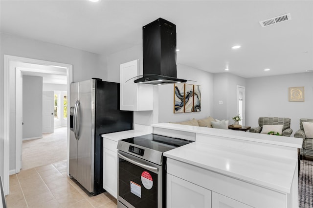 2416 Glacier St, Irving, TX 75062 - kitchen with appliances with stainless steel finishes, island range hood, open floor plan, white cabinetry, and recessed lighting