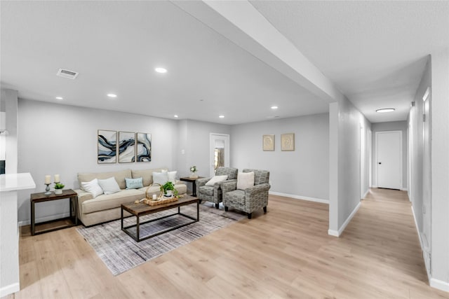 2416 Glacier St, Irving, TX 75062 - living area featuring light wood finished floors, baseboards, and recessed lighting