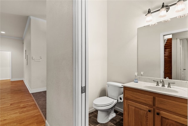 2800 Lomas Rodando Calzada, Kempner, TX 76539 - half bath featuring wood finished floors, vanity, and ornamental molding