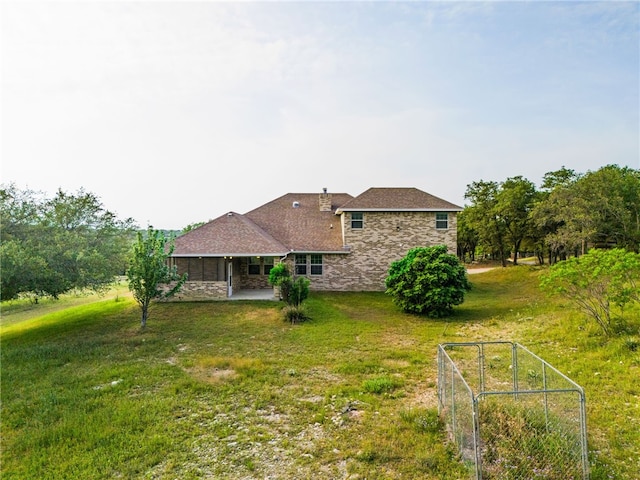 2800 Lomas Rodando Calzada, Kempner, TX 76539 - back of house featuring stone siding, a patio area, and a lawn