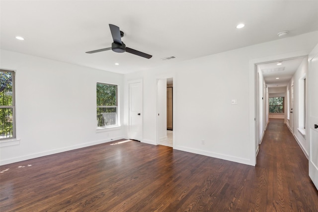 unfurnished bedroom featuring visible vents, baseboards, recessed lighting, dark wood-type flooring, and a ceiling fan