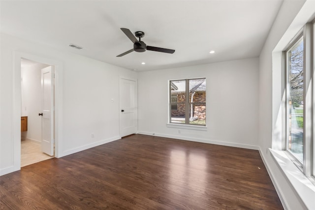 unfurnished bedroom featuring recessed lighting, visible vents, wood finished floors, and baseboards