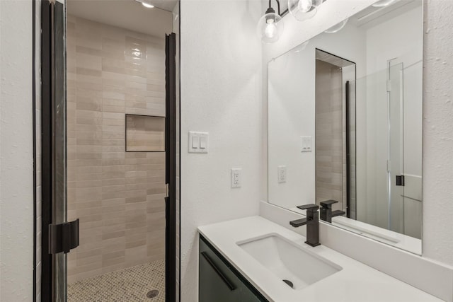 full bathroom featuring vanity and a stall shower