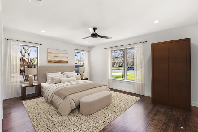 bedroom with visible vents, dark wood-style flooring, and recessed lighting