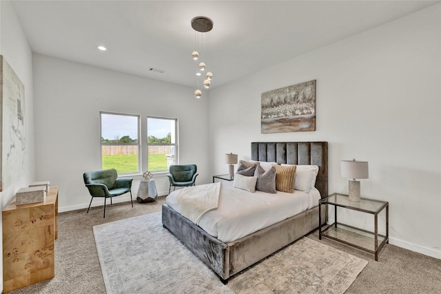 carpeted bedroom featuring baseboards, visible vents, and recessed lighting
