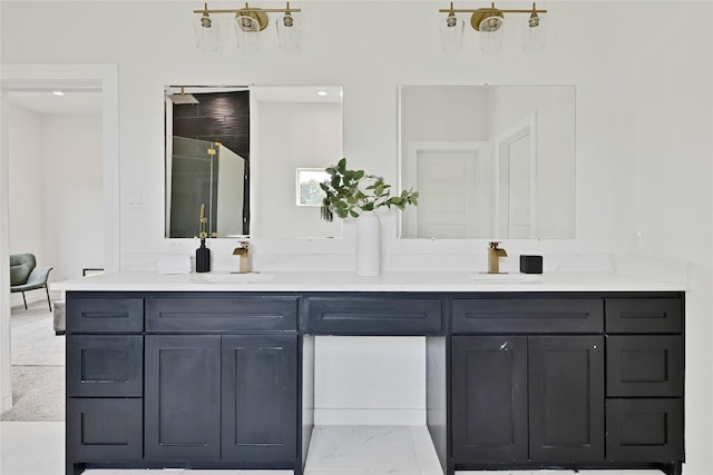 full bath featuring a shower, marble finish floor, a sink, and double vanity