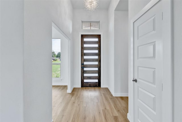 entrance foyer with light wood finished floors and baseboards