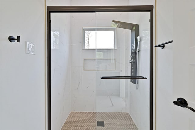 bathroom with a shower stall