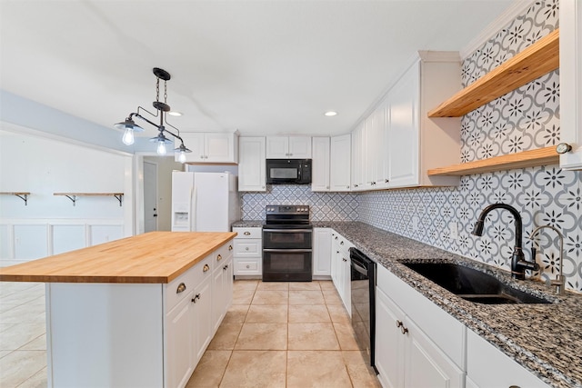 709 Verde Dr, Burleson, TX 76028 - kitchen featuring light tile patterned floors, tasteful backsplash, open shelves, a sink, and black appliances