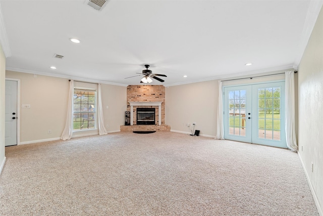 709 Verde Dr, Burleson, TX 76028 - unfurnished living room featuring carpet, baseboards, visible vents, a ceiling fan, and crown molding