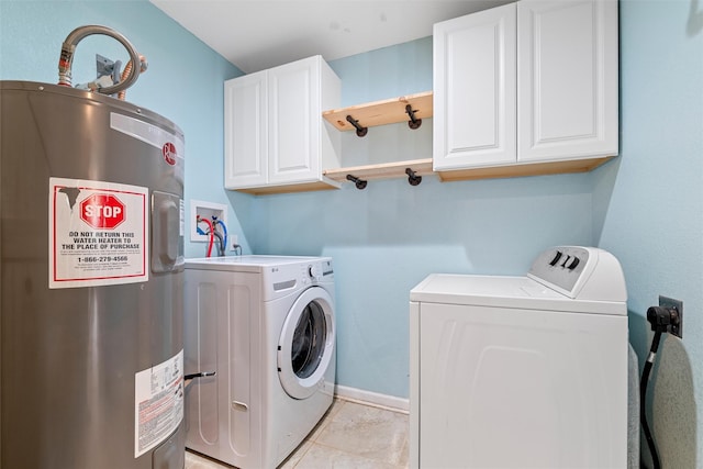 709 Verde Dr, Burleson, TX 76028 - laundry area featuring cabinet space, light tile patterned floors, baseboards, washer and dryer, and electric water heater