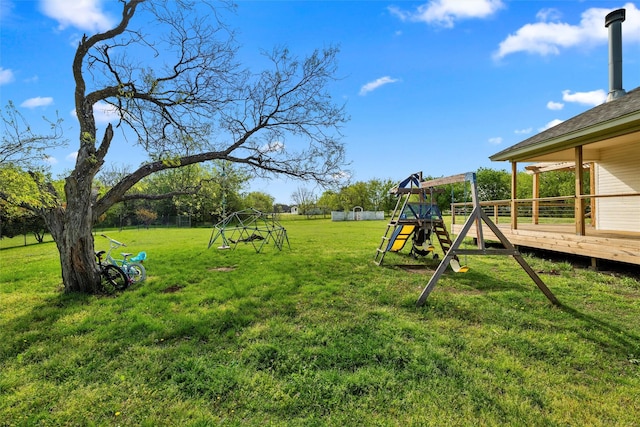 709 Verde Dr, Burleson, TX 76028 - view of yard featuring a wooden deck and a playground