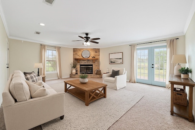 709 Verde Dr, Burleson, TX 76028 - living room featuring ornamental molding, visible vents, and light colored carpet