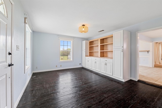 709 Verde Dr, Burleson, TX 76028 - interior space featuring visible vents, baseboards, and wood-type flooring