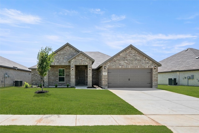 2608 Streamside Dr, Burleson, TX 76028 - french country home featuring a garage, driveway, a front lawn, and brick siding