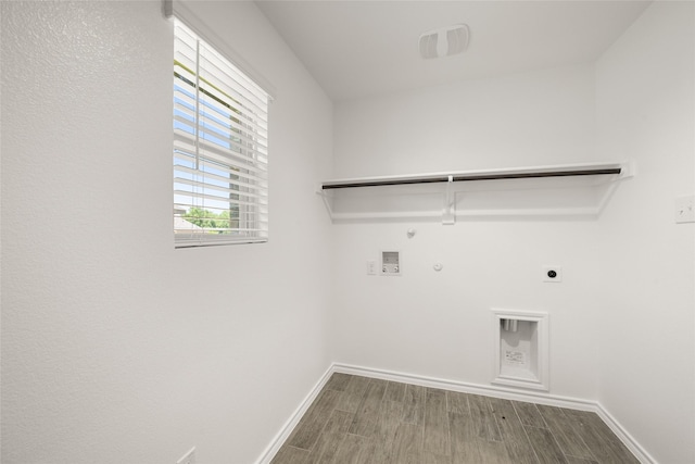 2608 Streamside Dr, Burleson, TX 76028 - washroom with hookup for a gas dryer, electric dryer hookup, wood finish floors, and washer hookup