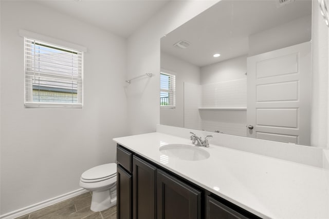 2608 Streamside Dr, Burleson, TX 76028 - bathroom with vanity, wood finished floors, and recessed lighting