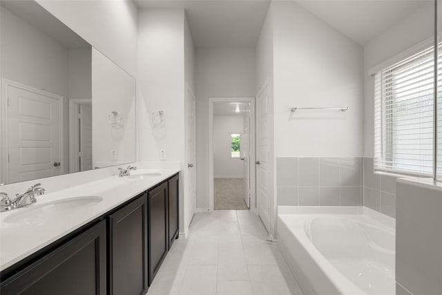 2608 Streamside Dr, Burleson, TX 76028 - bathroom with double vanity, a garden tub, and tile patterned floors
