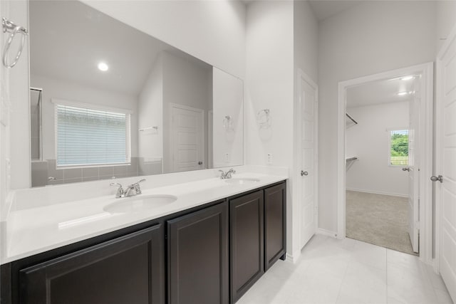 2608 Streamside Dr, Burleson, TX 76028 - full bath featuring double vanity, a spacious closet, and tile patterned floors