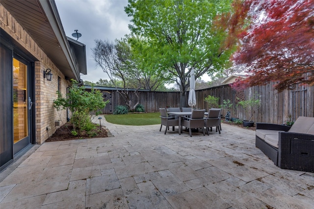 view of patio / terrace with a fenced backyard and outdoor dining space