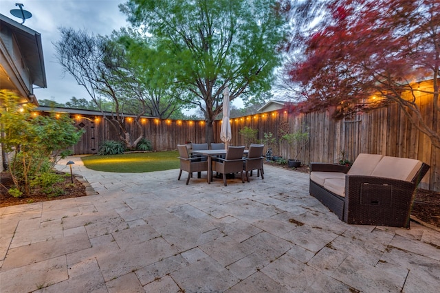 view of patio featuring outdoor dining area and a fenced backyard