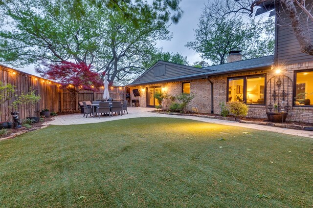 view of yard featuring fence and a patio area