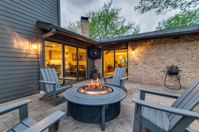 view of patio featuring an outdoor fire pit