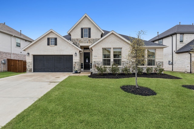 3644 Platte River Trl, Prosper, TX 75078 - view of front of property with a front yard, a garage, stone siding, concrete driveway, and fence