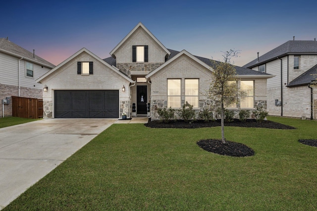 3644 Platte River Trl, Prosper, TX 75078 - view of front of home with a front yard, stone siding, concrete driveway, an attached garage, and fence