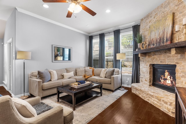 5604 Datewood Ln, Mckinney, TX 75071 - living room featuring a ceiling fan, crown molding, dark wood finished floors, baseboards, and a fireplace