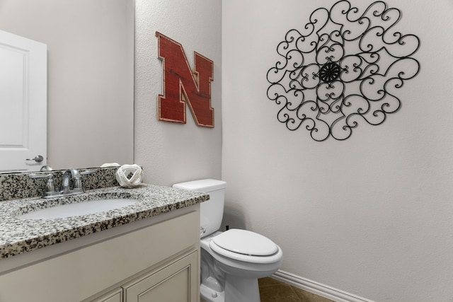 5604 Datewood Ln, Mckinney, TX 75071 - half bathroom with vanity, toilet, tile patterned floors, and baseboards