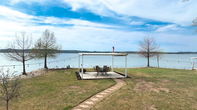 view of yard featuring a water view and a patio area