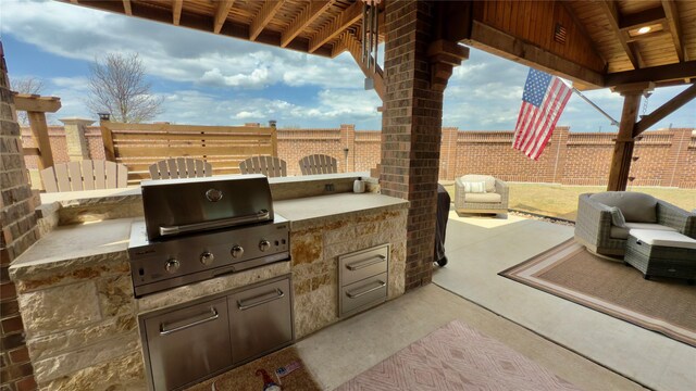 view of patio featuring a fenced backyard and an outdoor hangout area