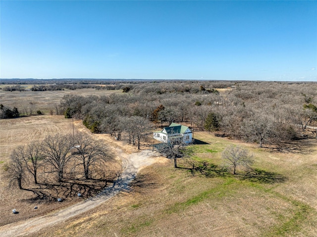 birds eye view of property with a rural view